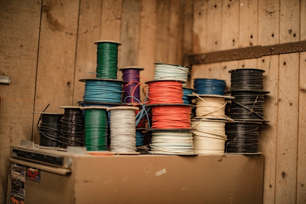 Spools of marine electrical wiring in a workshop