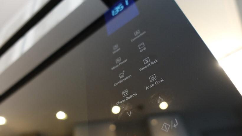 Close-up of the Panasonic NN-CS89LBBPQ combination steam oven control panel, showing cooking modes and digital display.